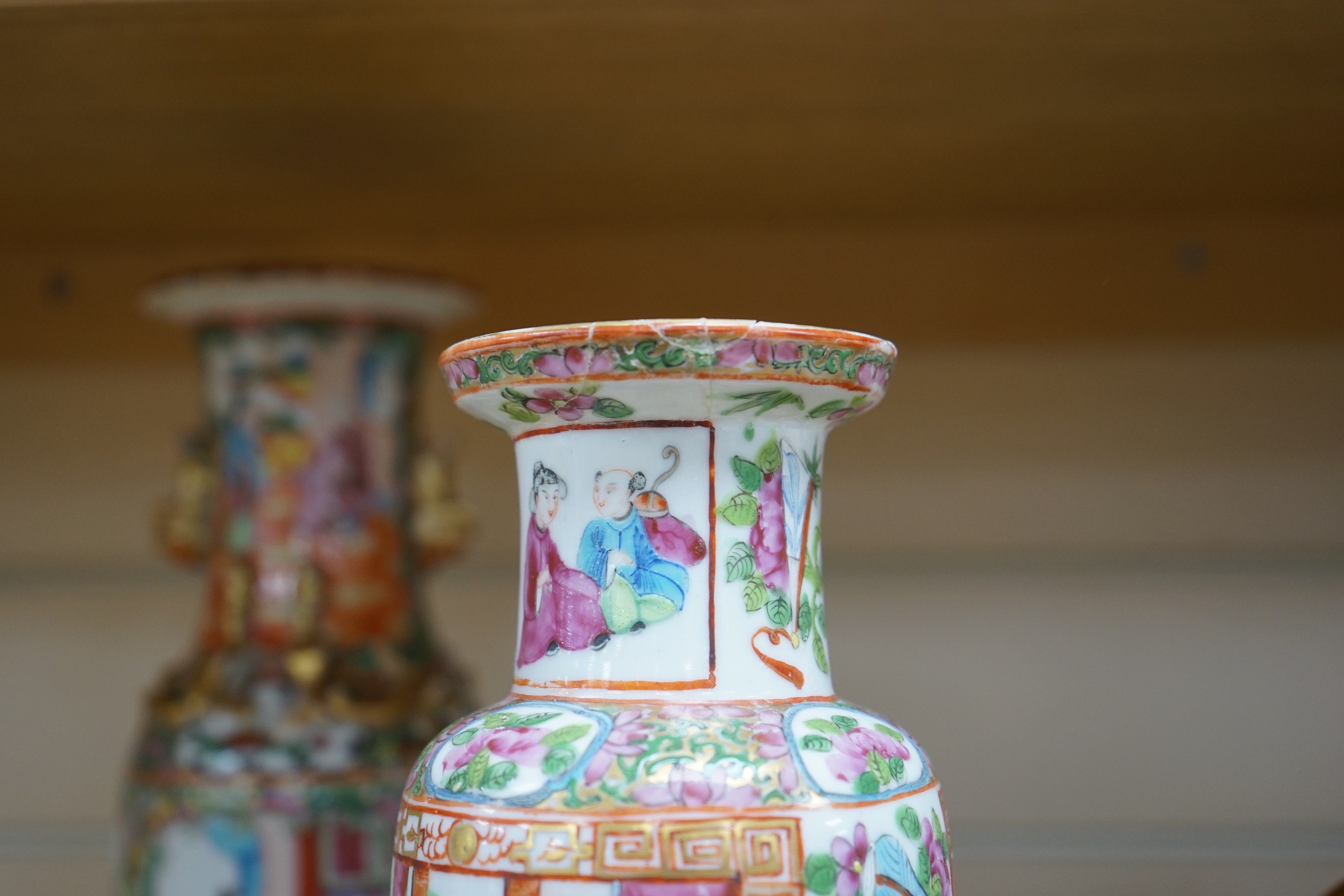 Three Chinese famille rose vases and a teapot, late 19th/early 20th century, tallest vase 29.5 cms high